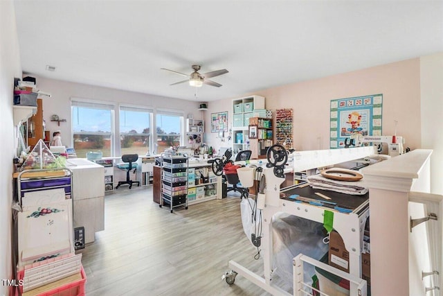 interior space with light wood-type flooring and ceiling fan