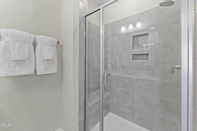 bathroom with an enclosed shower