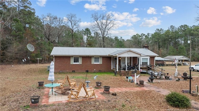 view of front of home with a fire pit