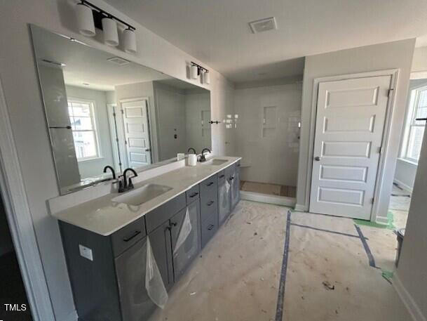 bathroom with vanity and concrete floors