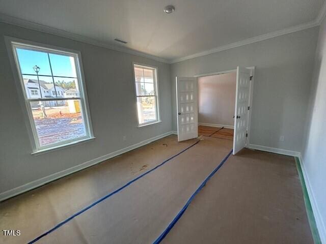 unfurnished bedroom featuring crown molding and a closet