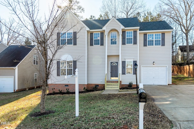 view of front facade with a garage and a front yard