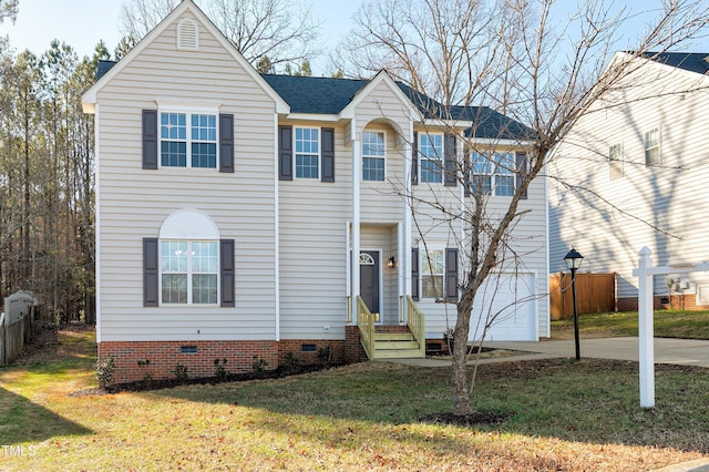 view of front of home featuring a garage and a front yard