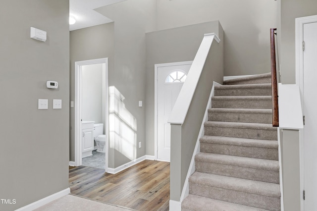 staircase featuring hardwood / wood-style floors