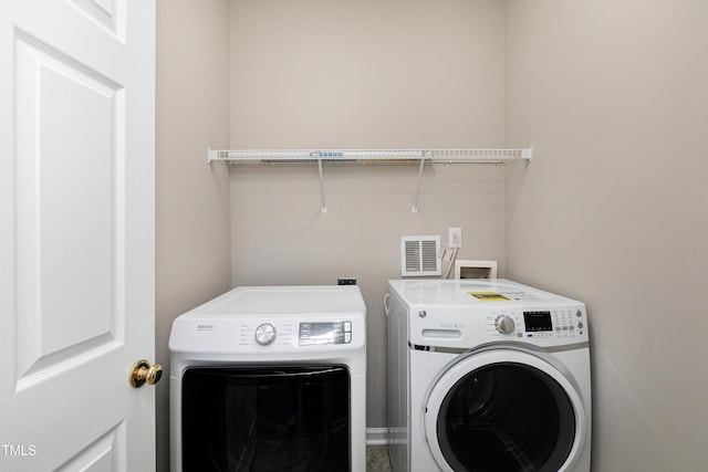 laundry area with washer and dryer