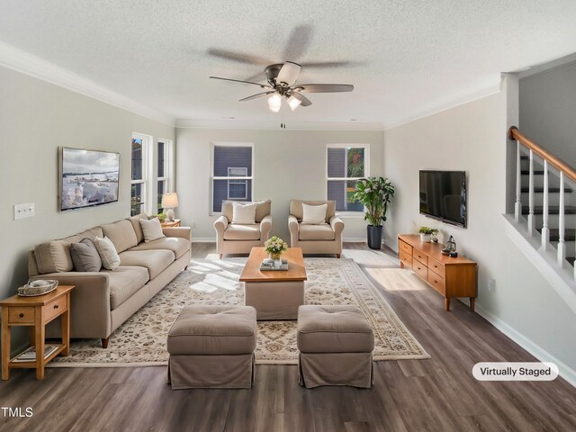 living room with hardwood / wood-style floors, crown molding, a textured ceiling, and ceiling fan