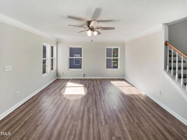 unfurnished room with ceiling fan, a textured ceiling, ornamental molding, and dark hardwood / wood-style floors