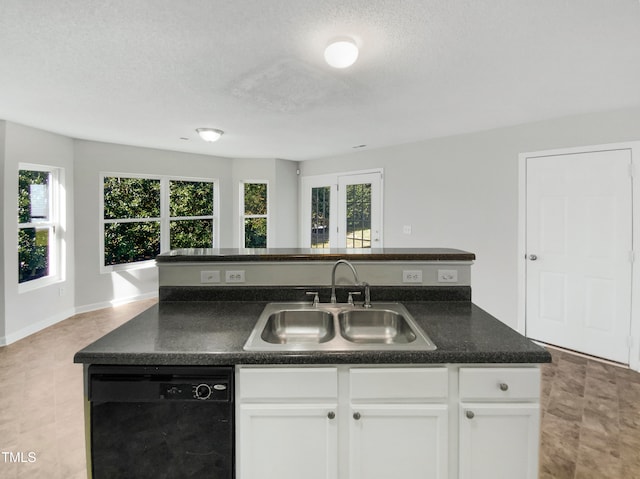 kitchen featuring white cabinets, a center island with sink, a textured ceiling, dishwasher, and sink