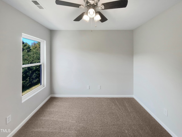 empty room featuring carpet floors and ceiling fan