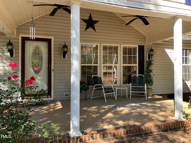 view of patio with ceiling fan and a porch