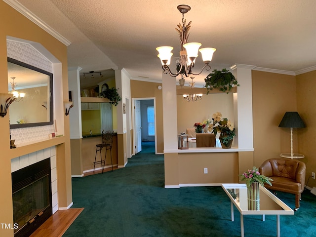 interior space with an inviting chandelier, dark colored carpet, vaulted ceiling, ornamental molding, and a fireplace