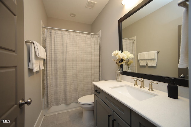 full bathroom with vanity, tile patterned flooring, toilet, and shower / tub combo