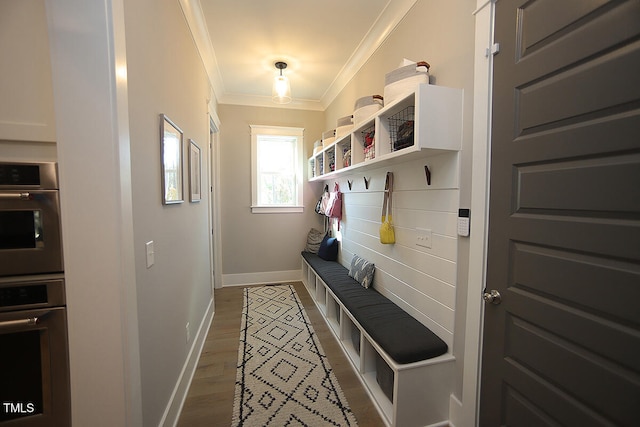 mudroom featuring ornamental molding and wood-type flooring