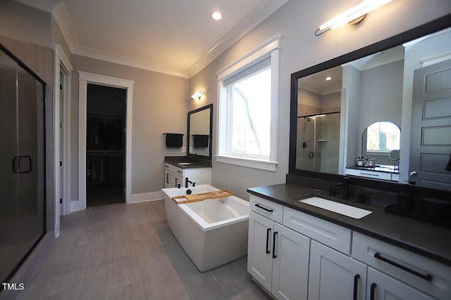 bathroom featuring vanity, ornamental molding, shower with separate bathtub, and plenty of natural light