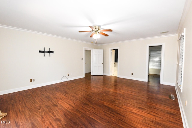 empty room featuring ornamental molding, dark hardwood / wood-style floors, a wealth of natural light, and ceiling fan