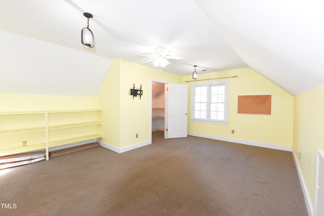 additional living space with lofted ceiling, carpet flooring, and ceiling fan