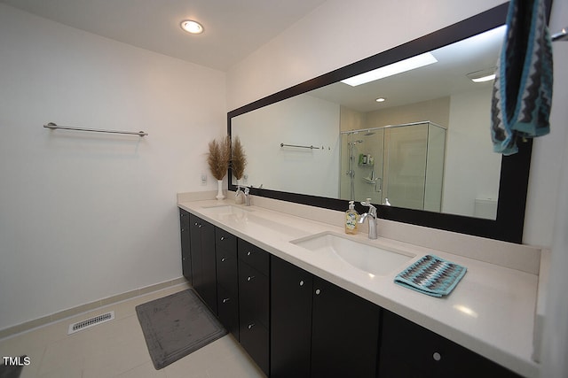 bathroom featuring vanity, an enclosed shower, toilet, and tile patterned floors