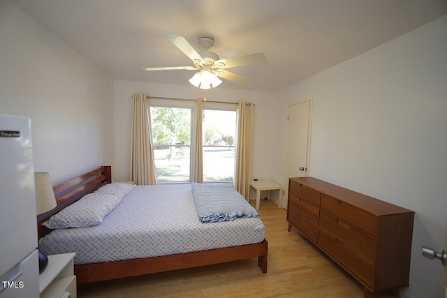 bedroom with ceiling fan and light wood-type flooring