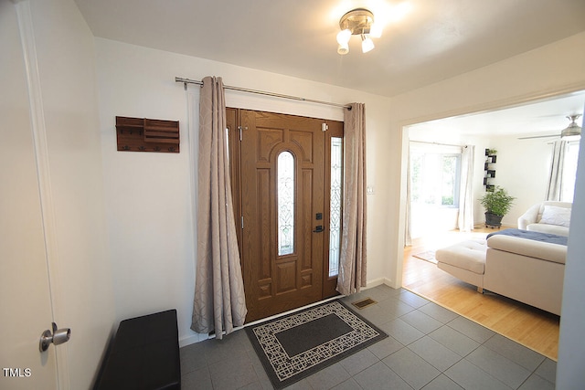 entrance foyer featuring hardwood / wood-style floors and ceiling fan