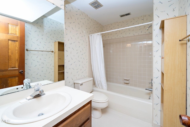 full bathroom featuring vanity, toilet, and shower / tub combo