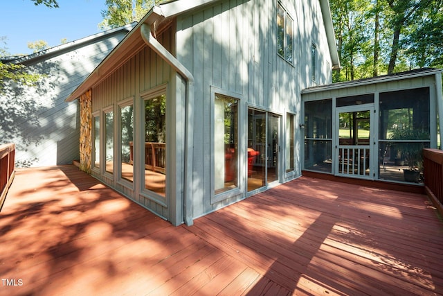 wooden terrace featuring a sunroom