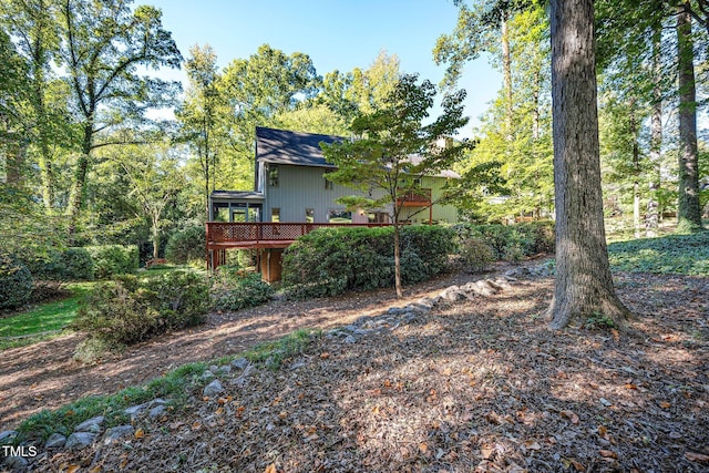 view of yard featuring a wooden deck