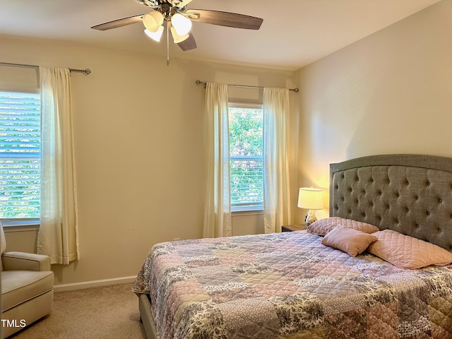 bedroom with light colored carpet and ceiling fan