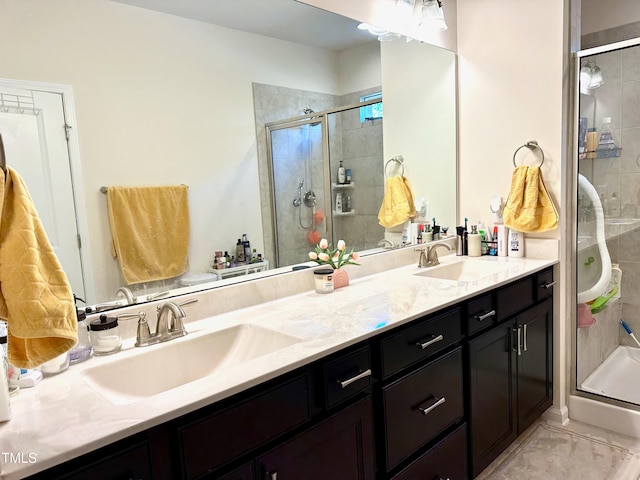 bathroom with vanity and a shower with shower door