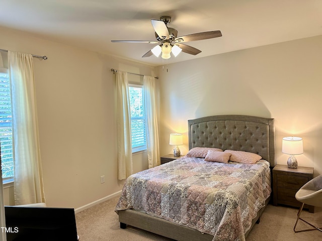 bedroom with light carpet and ceiling fan