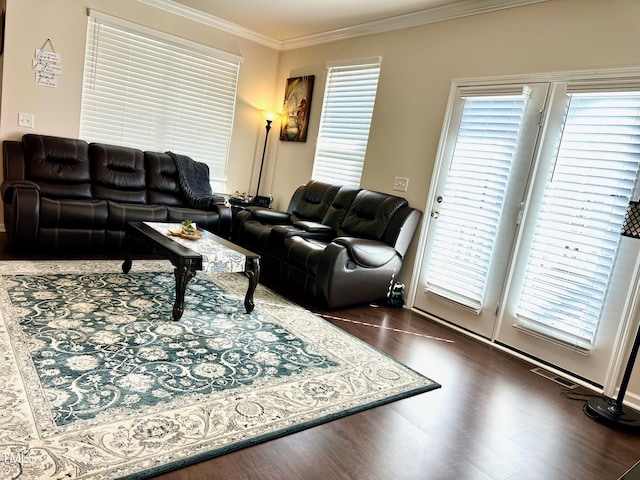 living room featuring dark wood-type flooring and ornamental molding