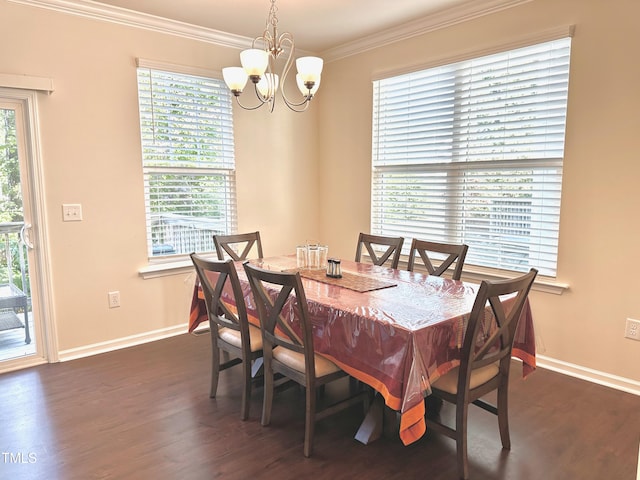 dining room featuring ornamental molding, a notable chandelier, and dark hardwood / wood-style flooring