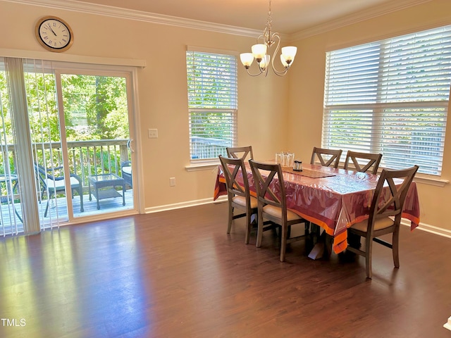 dining space with ornamental molding, plenty of natural light, and dark hardwood / wood-style floors