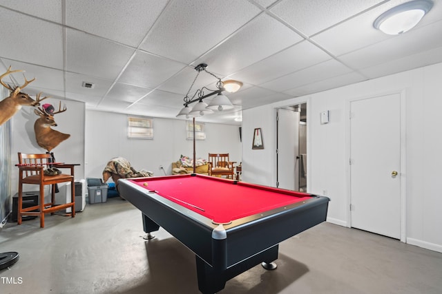 recreation room featuring pool table, a drop ceiling, and concrete floors