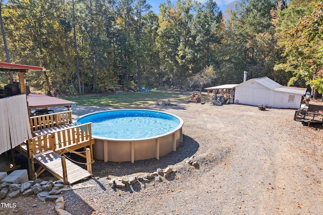 view of swimming pool featuring a storage unit