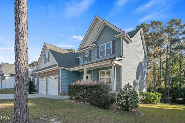 view of front facade featuring a front yard and a garage