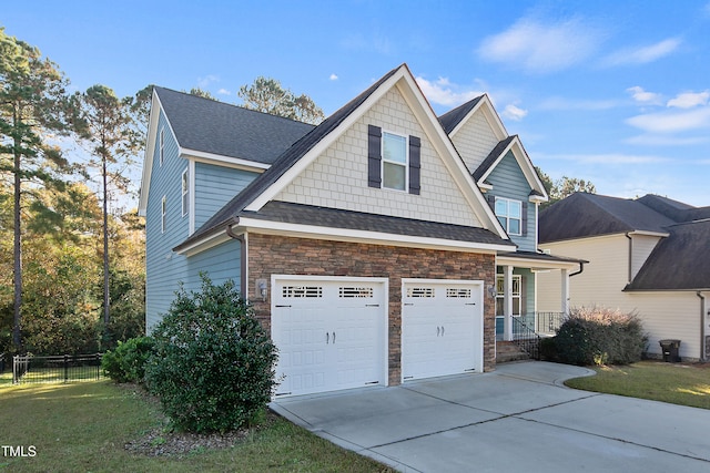 view of side of property featuring a garage and a lawn