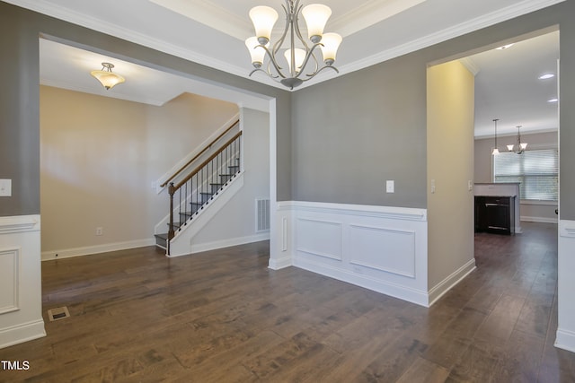 interior space featuring crown molding, a chandelier, and dark hardwood / wood-style flooring