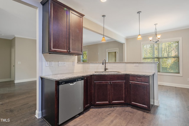 kitchen with dark wood-type flooring, tasteful backsplash, dishwasher, and sink