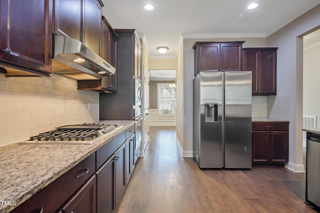 kitchen with appliances with stainless steel finishes, crown molding, and dark hardwood / wood-style flooring