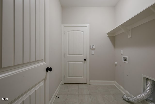 laundry room with washer hookup and light tile patterned floors