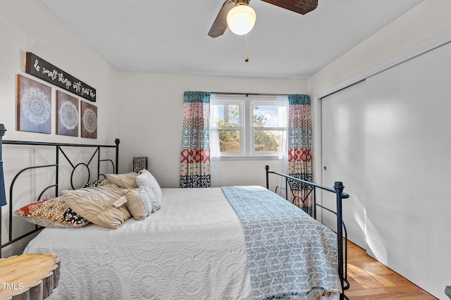 bedroom featuring a closet, ceiling fan, and hardwood / wood-style flooring