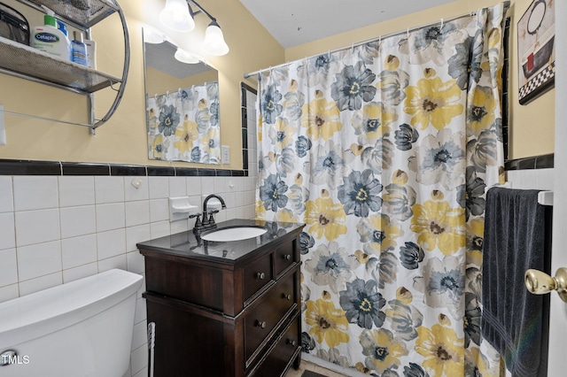 bathroom featuring vanity, tile walls, a shower with curtain, and toilet