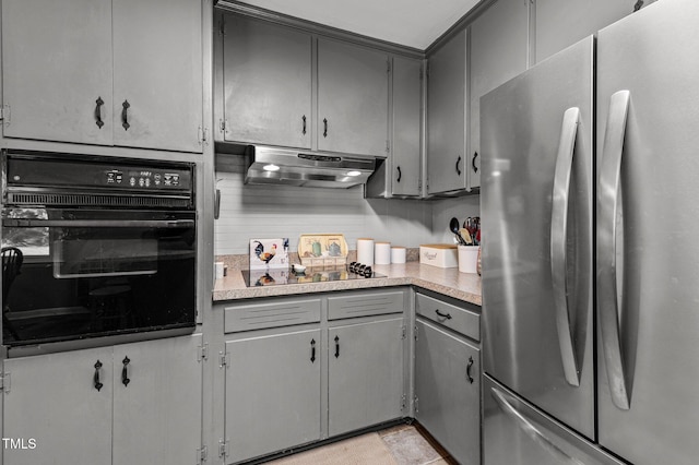 kitchen with gray cabinetry and black appliances