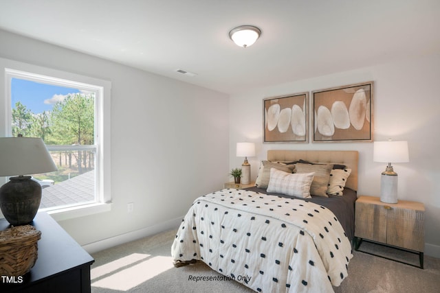 bedroom with light colored carpet