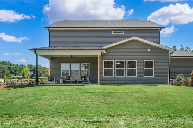 back of property featuring a yard, a patio, and ceiling fan