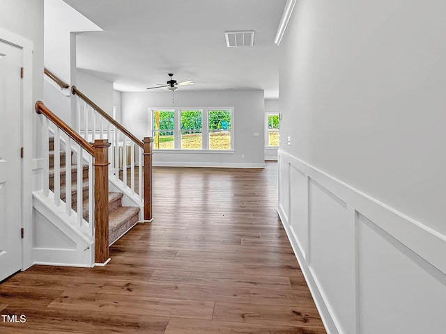 hallway with stairway and wood finished floors