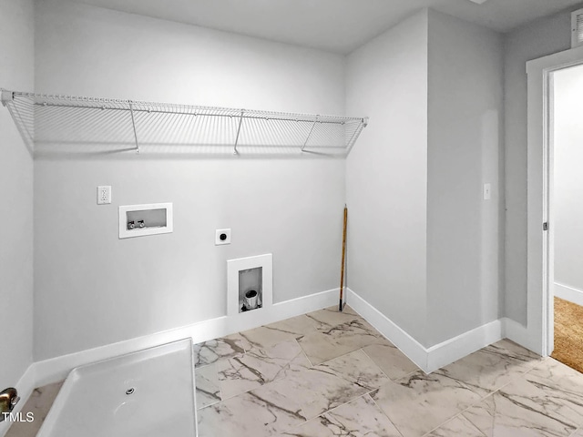 laundry room featuring hookup for an electric dryer, washer hookup, light marble finish floors, and baseboards