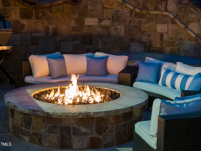 view of patio featuring an outdoor fire pit