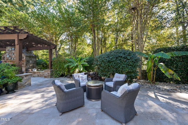 view of patio featuring an outdoor living space and a pergola