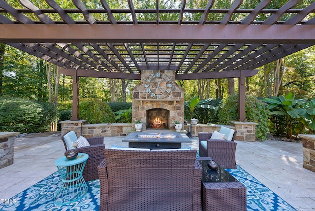 view of patio / terrace with a pergola and an outdoor stone fireplace